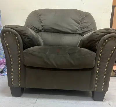 Brown suede armchair with studded arms (used)