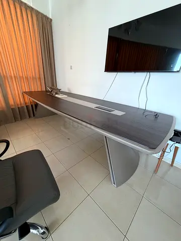 Long grey executive office desk with cable management