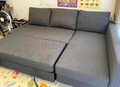 My gray L-shaped convertible sofa bed - good condition