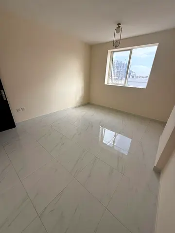 Two-bedroom apartment with a living room - Al Jurf 3, Ajman - Central air conditioning - Family accommodation - Prime location