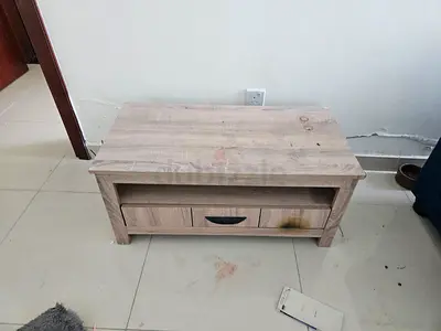 Small light wood coffee/TV table with storage drawer