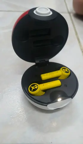 Razer pokemon yellow Bluetooth earbuds with round charging case - working condition