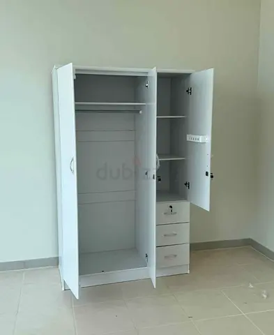 My white 3-door wardrobe with hanging rail, shelves and 3 drawers