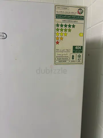 White top-freezer refrigerator (working) - used