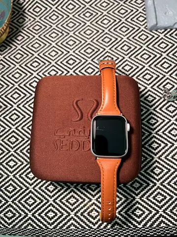 Square smartwatch with brown leather strap - good condition