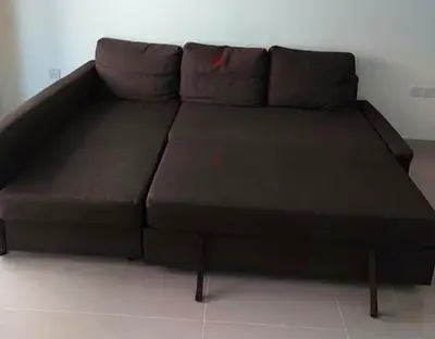 Brown L-shaped sofa bed (converts to bed) - good condition