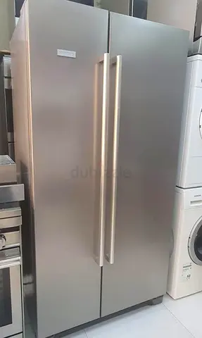 Selling my stainless steel side-by-side refrigerator/freezer - good working condition