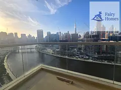 1BR Apartment | Fairview Residency | Canal &amp; Burj Khalifa View | Balcony