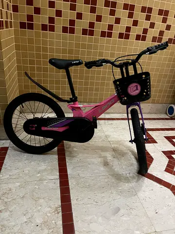 Pink kids bicycle with front basket - excellent condition