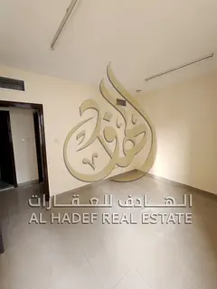 Two-bedroom apartment with a living room for rent in Abu Shagara, featuring a spacious area, balcony