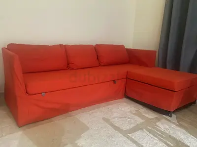My orange 3-seater sofa bed with ottoman - good condition. Inclusive of topper and white carpet