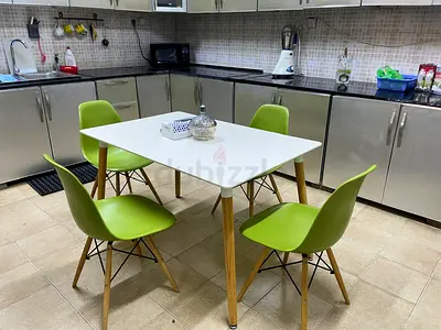 White ikea dining table with 4 green chairs - used, good condition