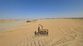 Investment Land for Sale on Two Roads in Al Sajaa – Strategic Location