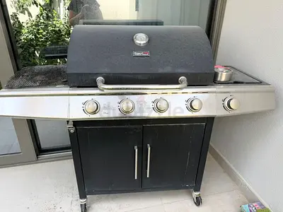 My outdoor gas BBQ grill with storage cabinet — working, needs cleaning