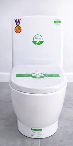 White ceramic squat toilet with integrated cistern