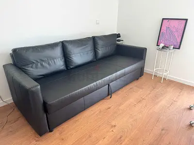 Black 3-seater leather sofa bed