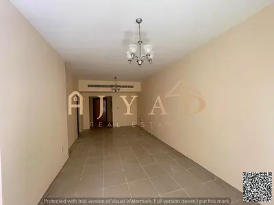For annual rent: Two-bedroom apartment in Al Rashidiya 3, directly on Khalifa Street. Free air conditioning, built-in wardrobes, and an open view