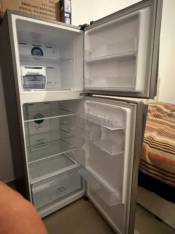 Im selling my two-door top-freezer refrigerator — works well, clean interior