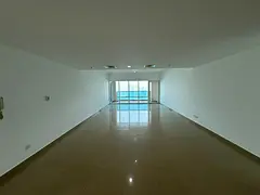 Luxurious 3-bedroom apartment with a living room and stunning sea view, free AC, parking, gym, and p