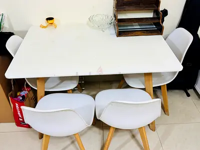 My white dining table with 4 chairs (wooden legs) - good condition