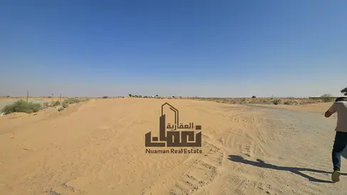 Strategic Investment in Al Sajaa – Corner Land for Sale on Two Roads