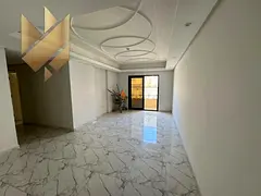 Two rooms and a living room for rent in New Muwailih, with a spacious area and a balcony.