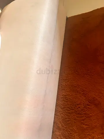 Medium sized carpets with big red bag