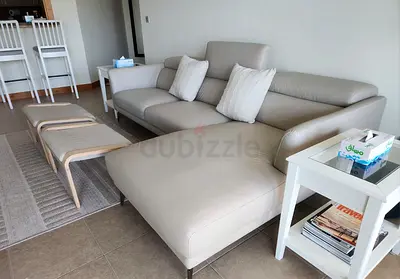 Light grey leather L-shaped sofa with chaise — well maintained