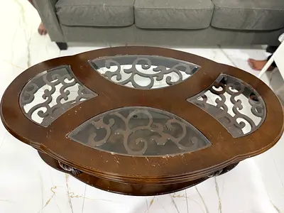 Oval wooden coffee table with glass inserts