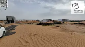 Land for sale in Ajman, Al Zahiyah area, including registration and ownership fees.