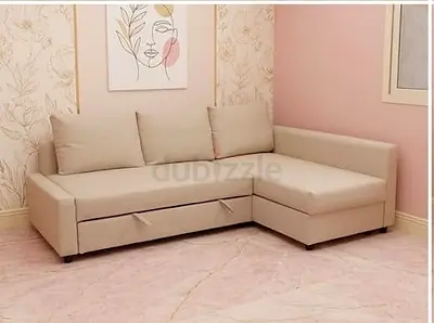 Beige L-shaped sofa with chaise and storage - good condition