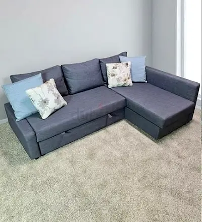 Grey L-shaped corner sofa with under-seat storage - good condition