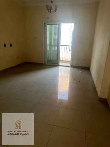 Two bedrooms and a living room for sale in Al Nahda, Sharjah, with parking, suitable for living or investment.