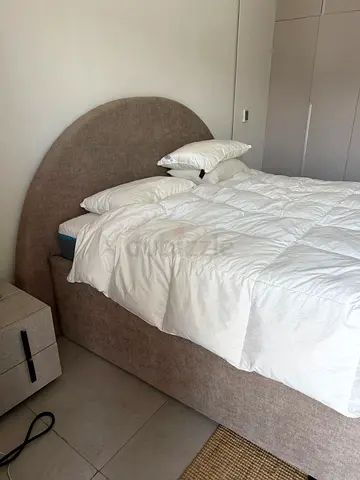 Upholstered bed frame with curved headboard (beige) HYDRAULIC Storage