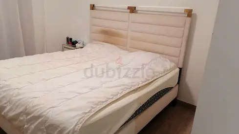 Upholstered bed with padded headboard  mattress