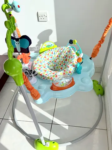 Baby jumper/exersaucer with activity toys - gently used