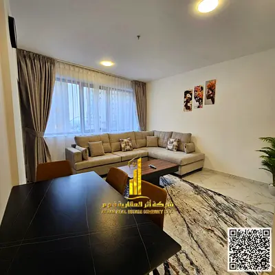 Luxury one-bedroom apartment with a balcony and open views. Ajman Corniche. Fully furnished, available for monthly rent.