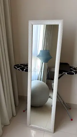 Full-length floor mirror with textured white frame