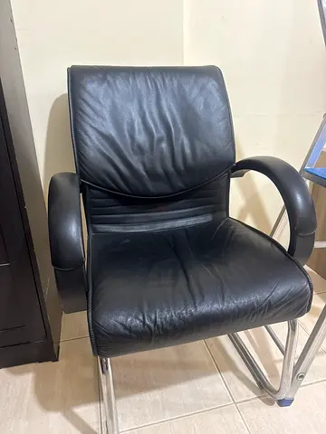 Black leather office chair with chrome frame