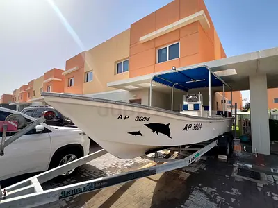 Family and Fishing Boat