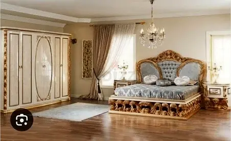 Beige upholstered bed set with dresser and nightstands