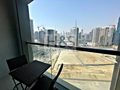 مفروشة بغرفتي نوم | الخليج التنفيذي A | شرفة مطلة على القناة والأفق
