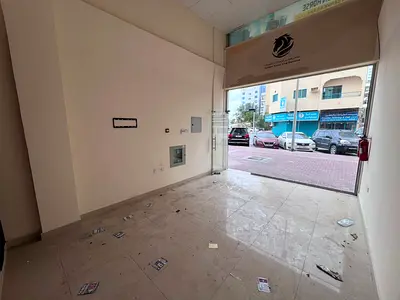 Excellent shop space for annual rent in Al-Rumaila, second row from the Corniche, prime location and excellent size.