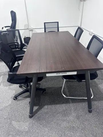 Office conference table with 5 mesh chairs