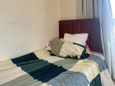 Single upholstered bed with padded headboard - used (frame only)