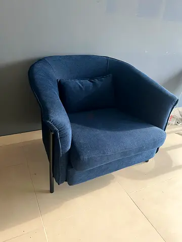 Navy blue upholstered armchair