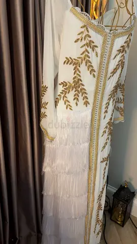 White embroidered kaftan with gold detailing and tiered fringe