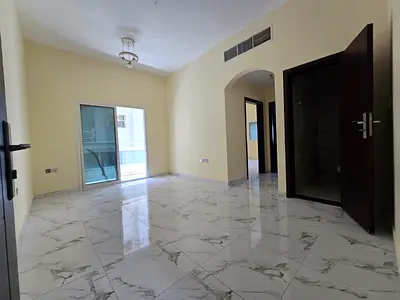 For annual rent in Al Jurf 2, Ajman: One bedroom and living room, 32,000 AED payable in 4 installments, with a balcony and excellent view.