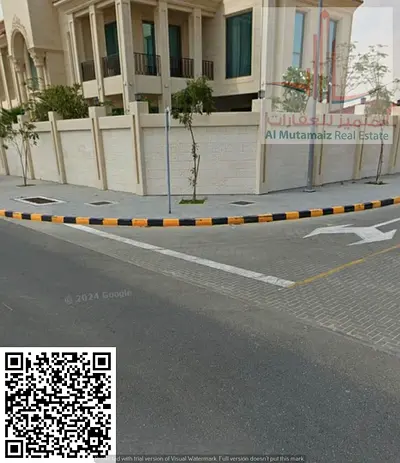A residential plot of land for sale in the Al Hooshi area of ​​Sharjah, measuring 5100 square feet.