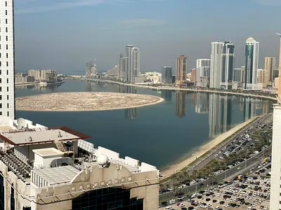 Best 3BR apartment in Al Taawun – well-distributed rooms, central AC, free parking, gym & pool, balcony with open sea view, built-in closets
